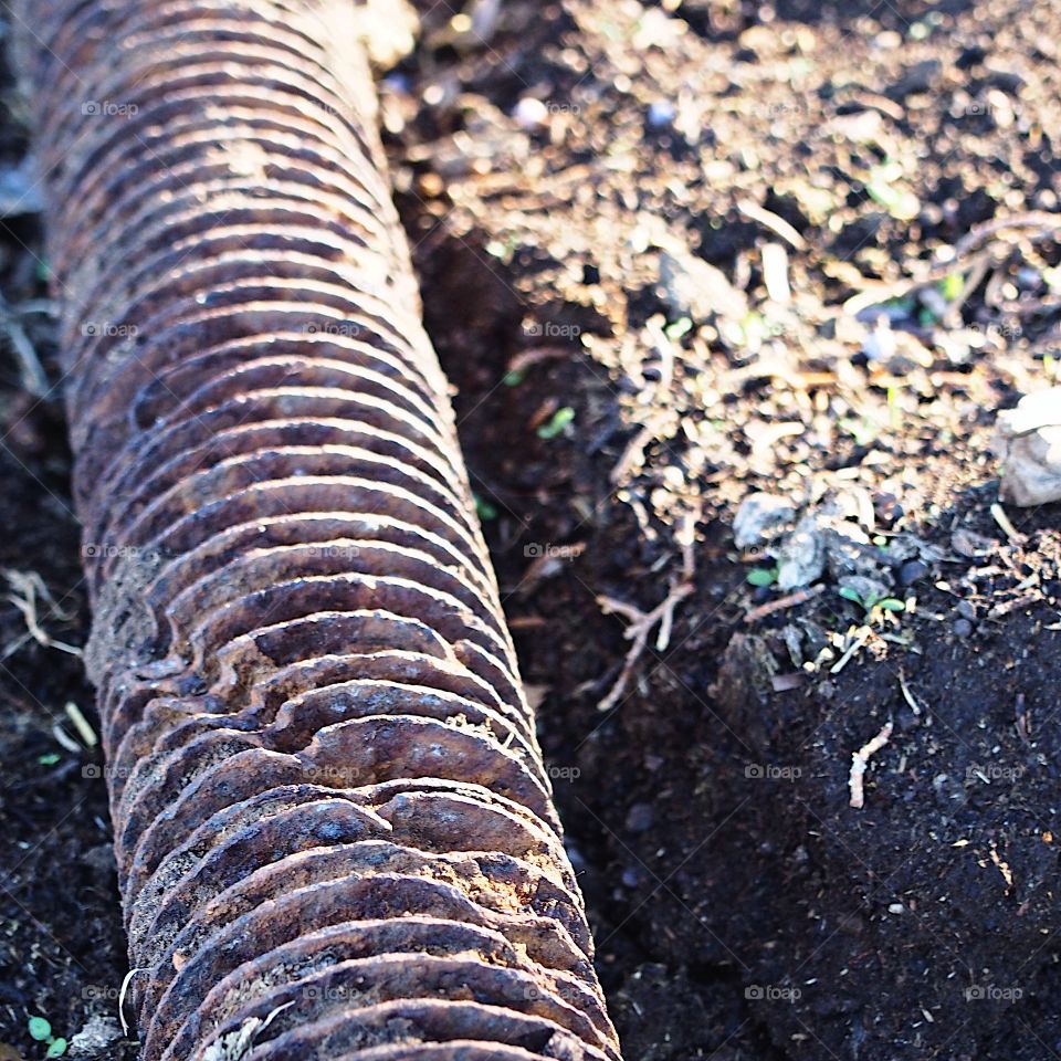A large rusted fastener showing the history of the area abandoned at an old industrial site converted to a park in Central Oregon.