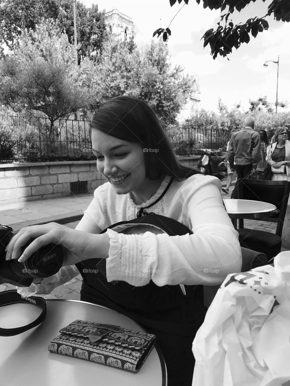 Smiling woman holding camera