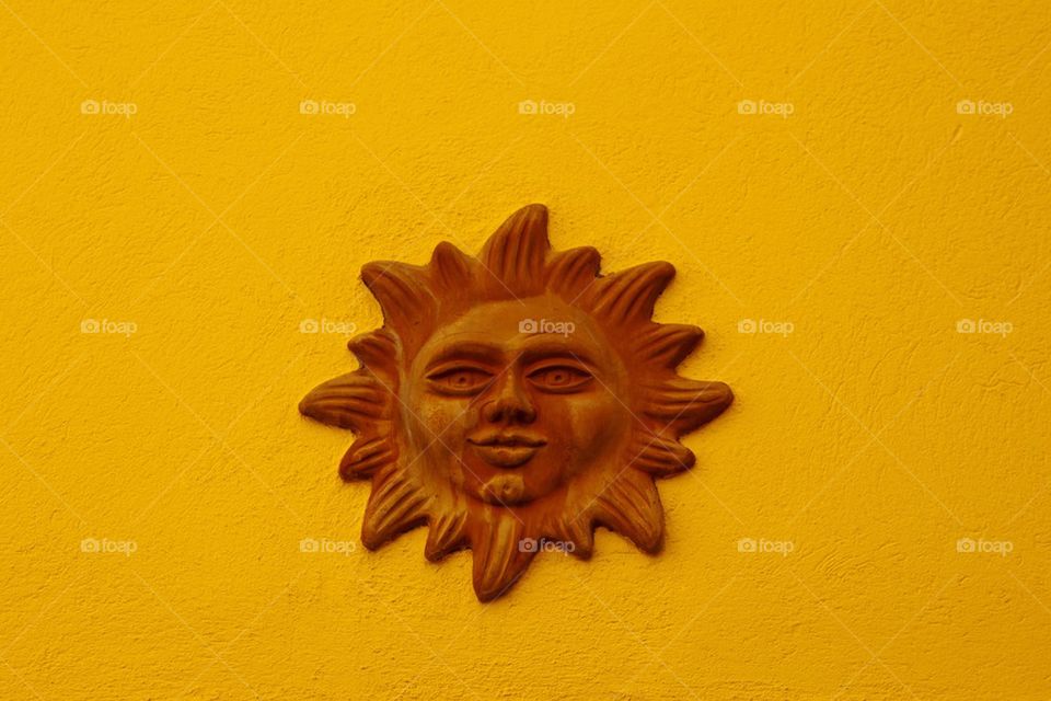 Sun symbol on a house wall