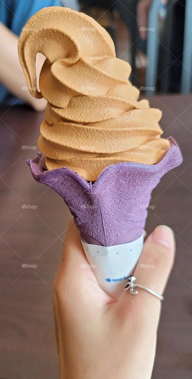 Halloween color ice cream, Thai milk tea flavored ice cream with purple cone cookies