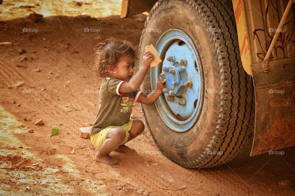 kid trying to break the tire