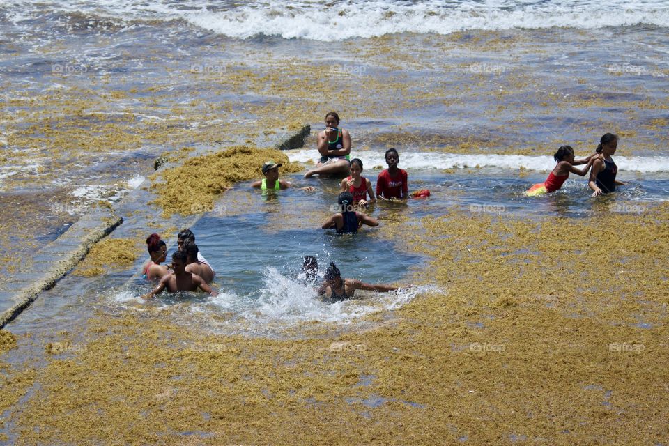 People Having Fun In The Sea