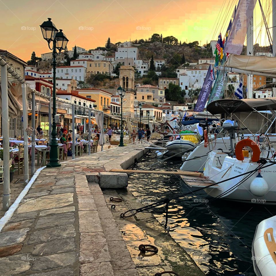 Boats at sunset in hydra, greece