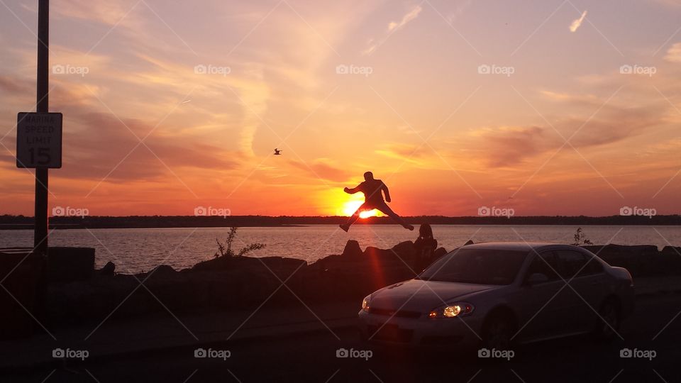jumping  for sunset joy. jumping  for sunset joy