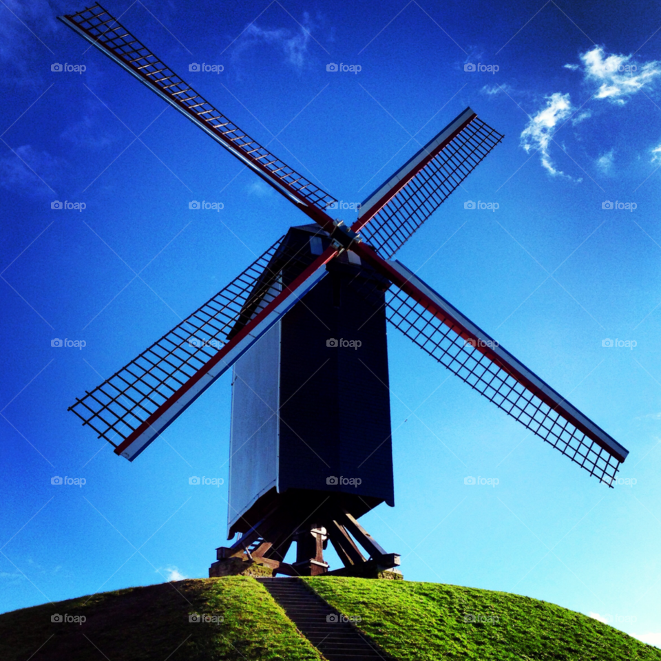 sky blue bruges windmill by mbambino
