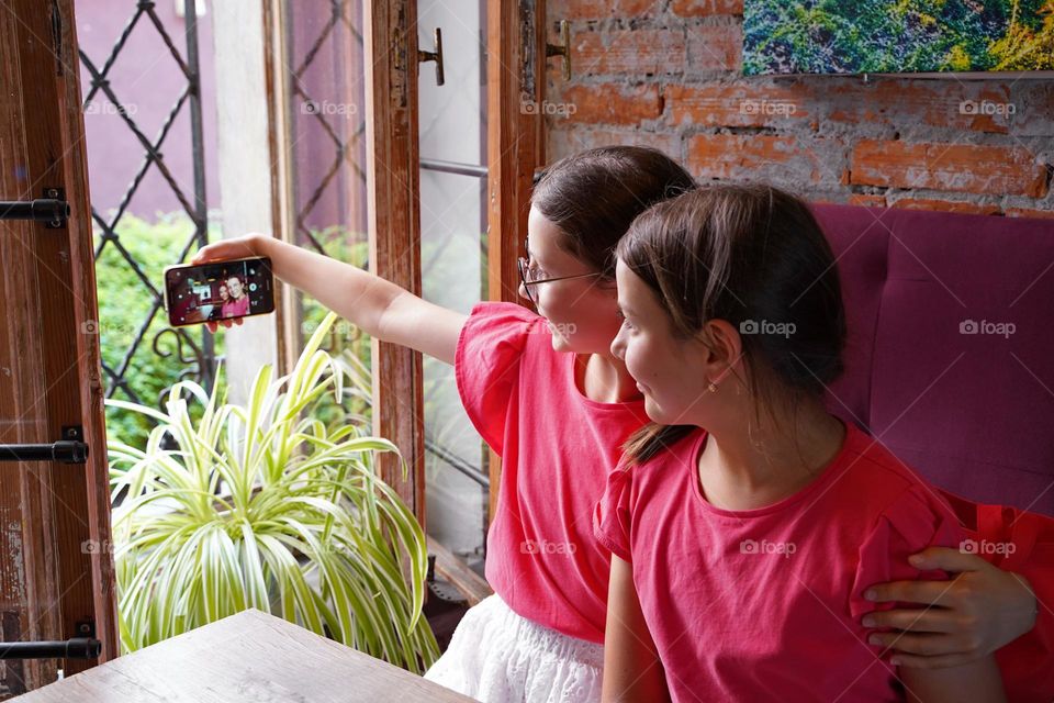 Two girls with phone