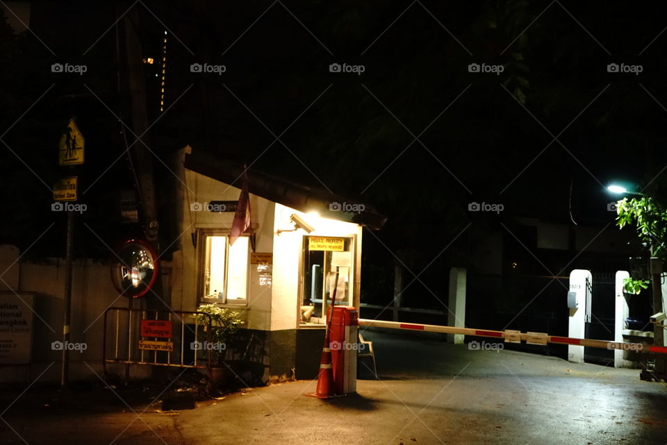 Small security village entrance at night