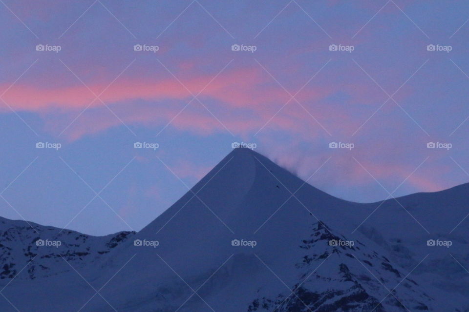 The Silberhorn peak, Wengen, Switzerland. Beautifully framed by pink glowing clouds! 