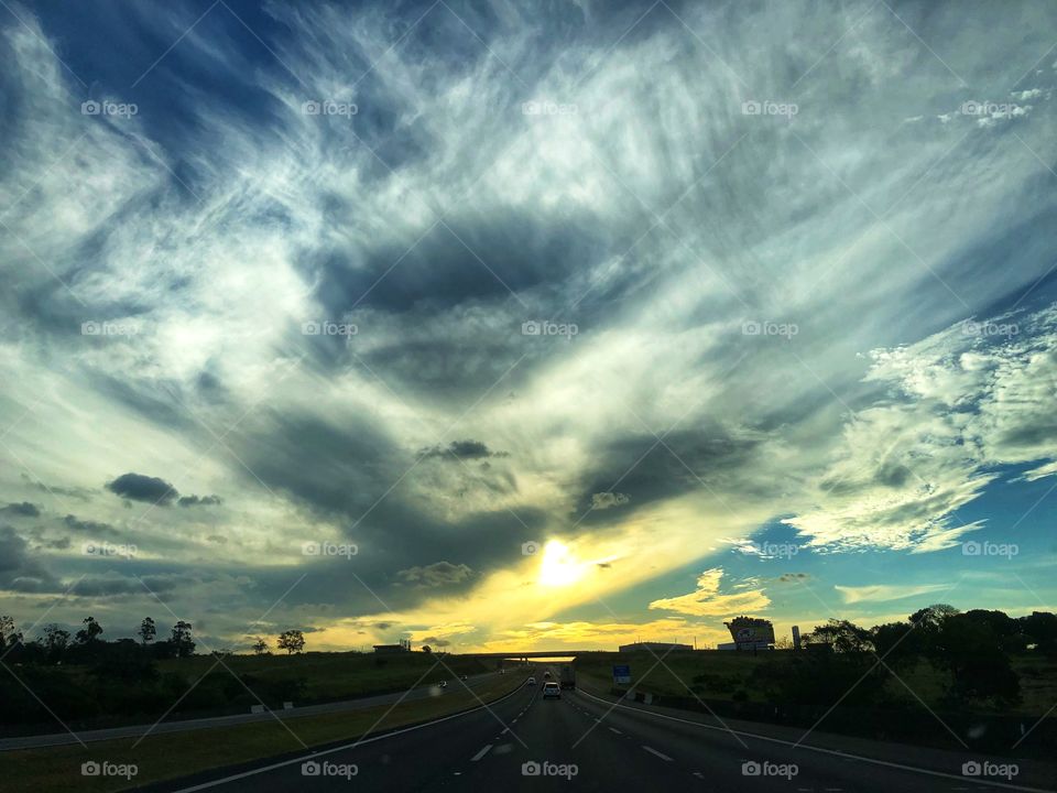 Sunset of an Autumn Day, saw from the Highway, while going back home after a long day working. A very different cloud formation contributing to this beautiful scene.