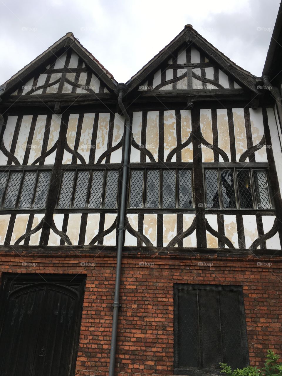 Exterior view of the medieval Manor House timber framing and windows at Gainsborough Old Hall