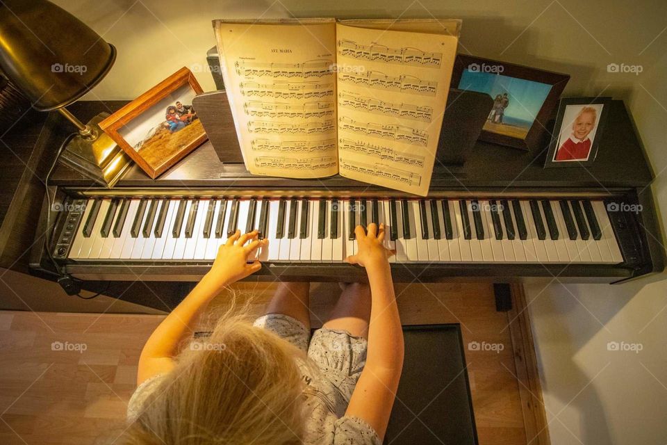 Lili playing piano.