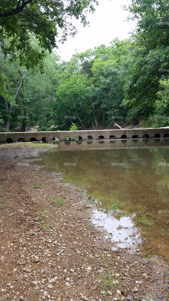 Bridge through creek. Flat bridge at Summer Stretch