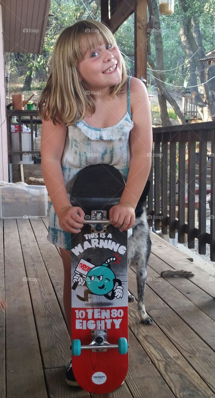 Her first skateboard. After asking for months..she got her very first skateboard.