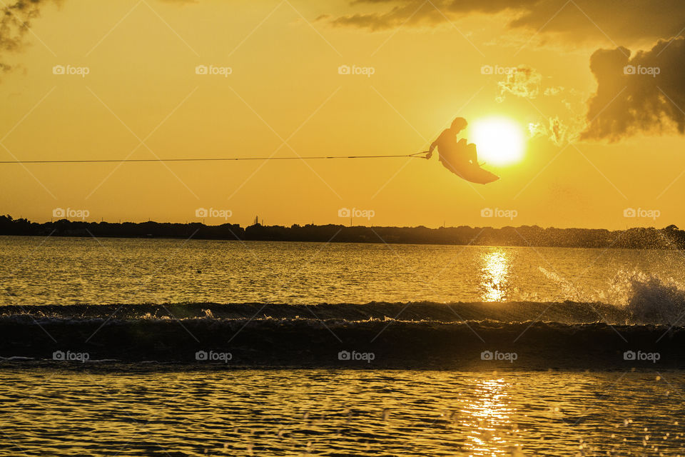 Wakeboarder wrapped around the sun 