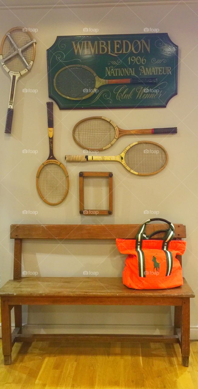 Vintage tennis bats on display 