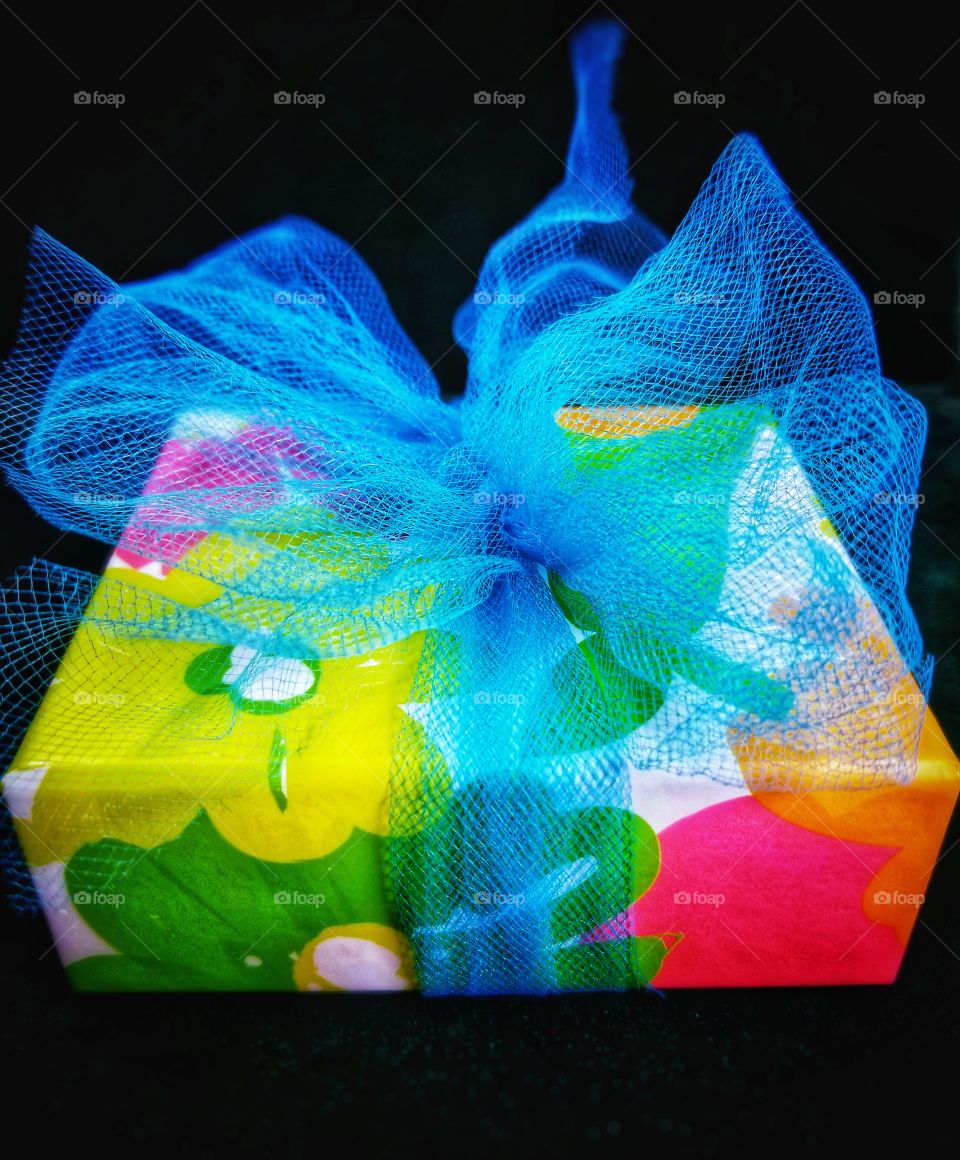 Pretty Package with Colorful Flowers and a Blue Bow