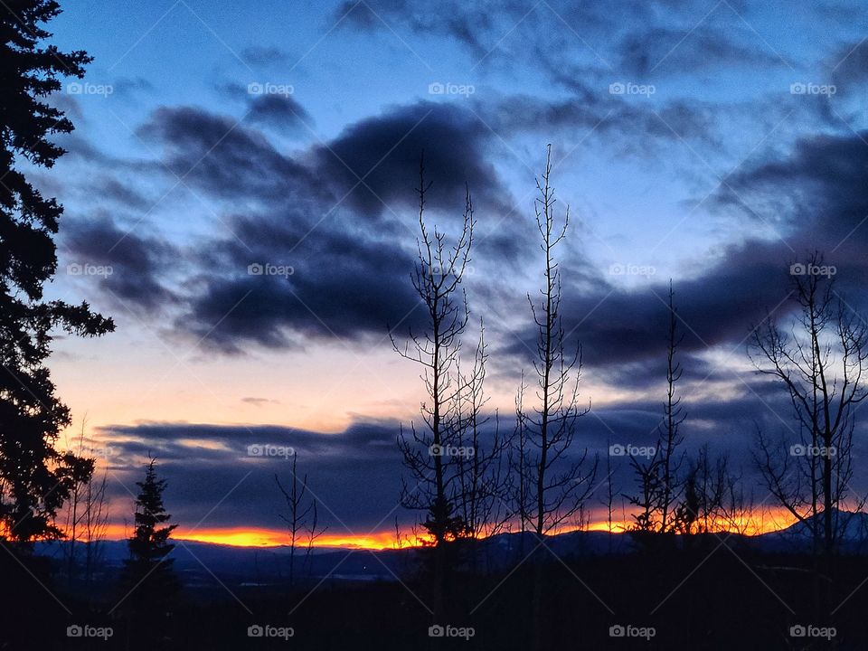Wintertime sunsets over mountain scapes in the White North