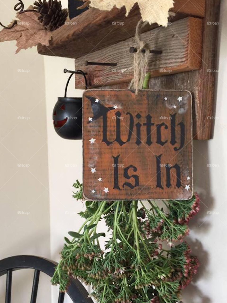 Witch is in Halloween decoration  hanging handcrafted stenciled sign 