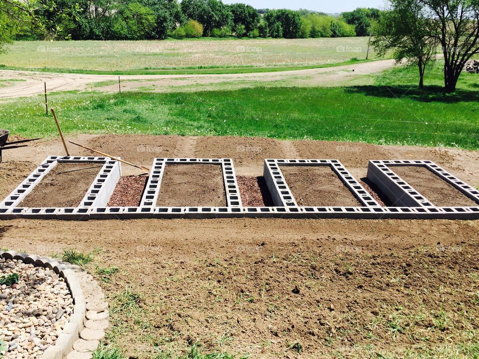 Raised garden beds made from cinder block and ready for planting 