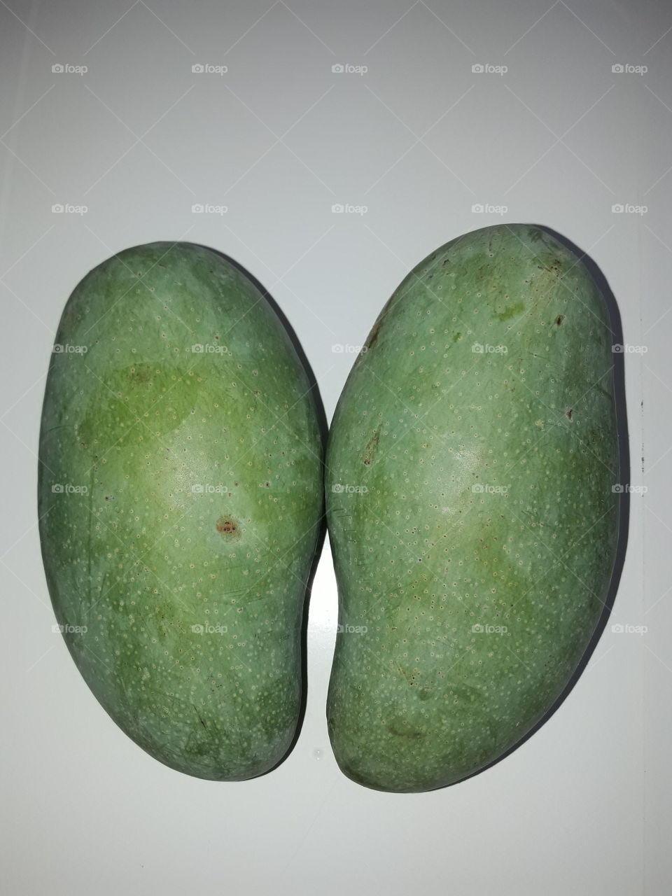 a pair of thai green mangoes "mamuang kiew sa wei"