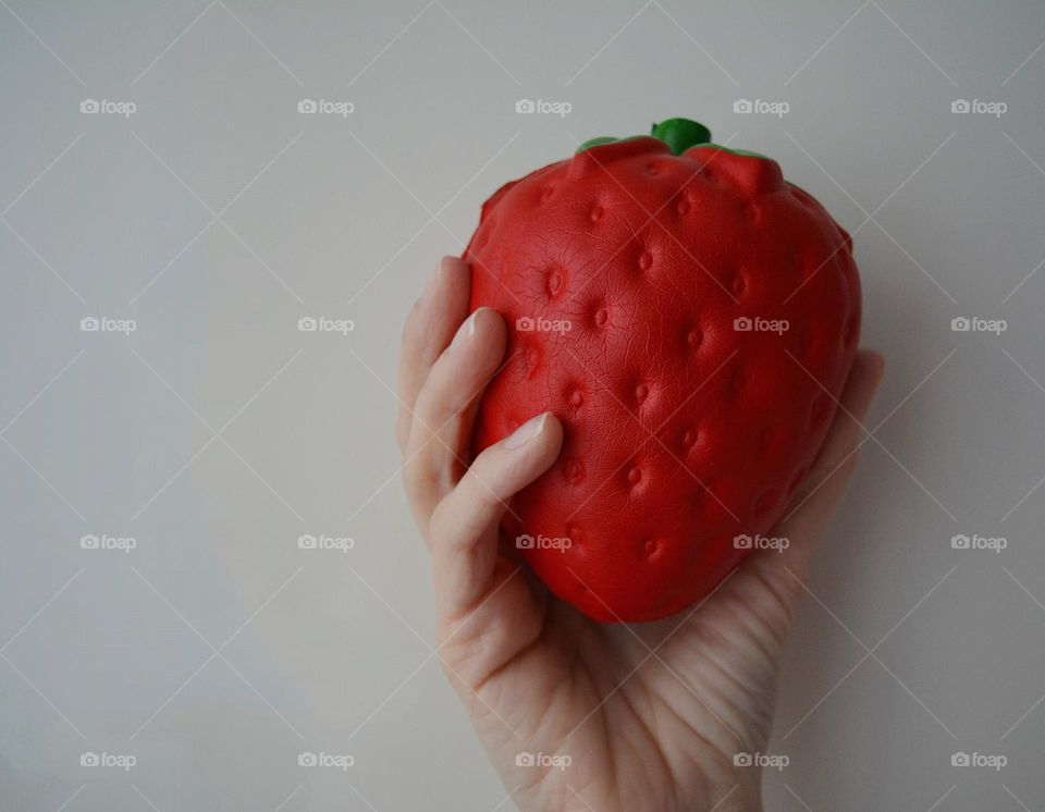 magenta colour female hand and strawberry 🍓