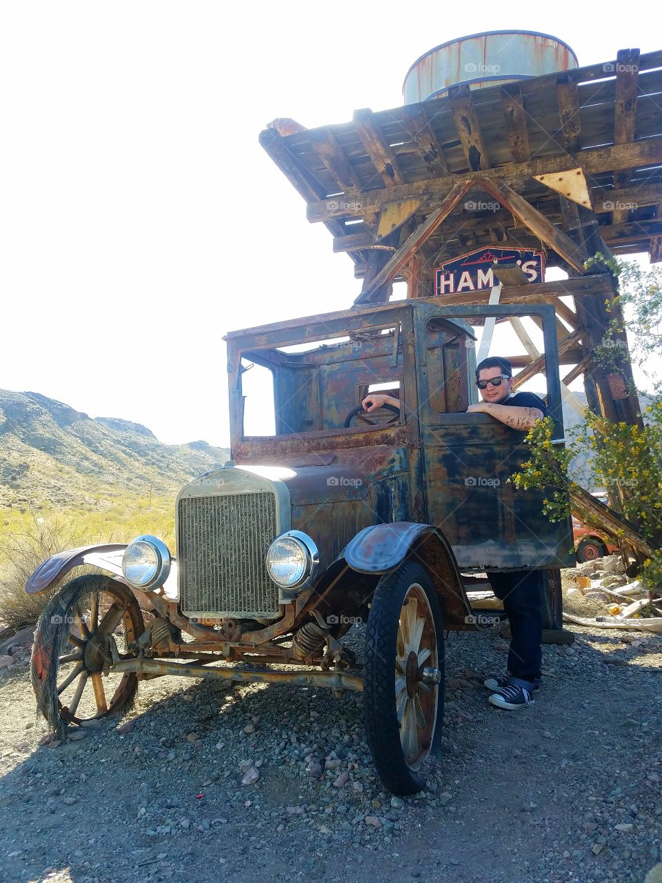 man with old car infront
