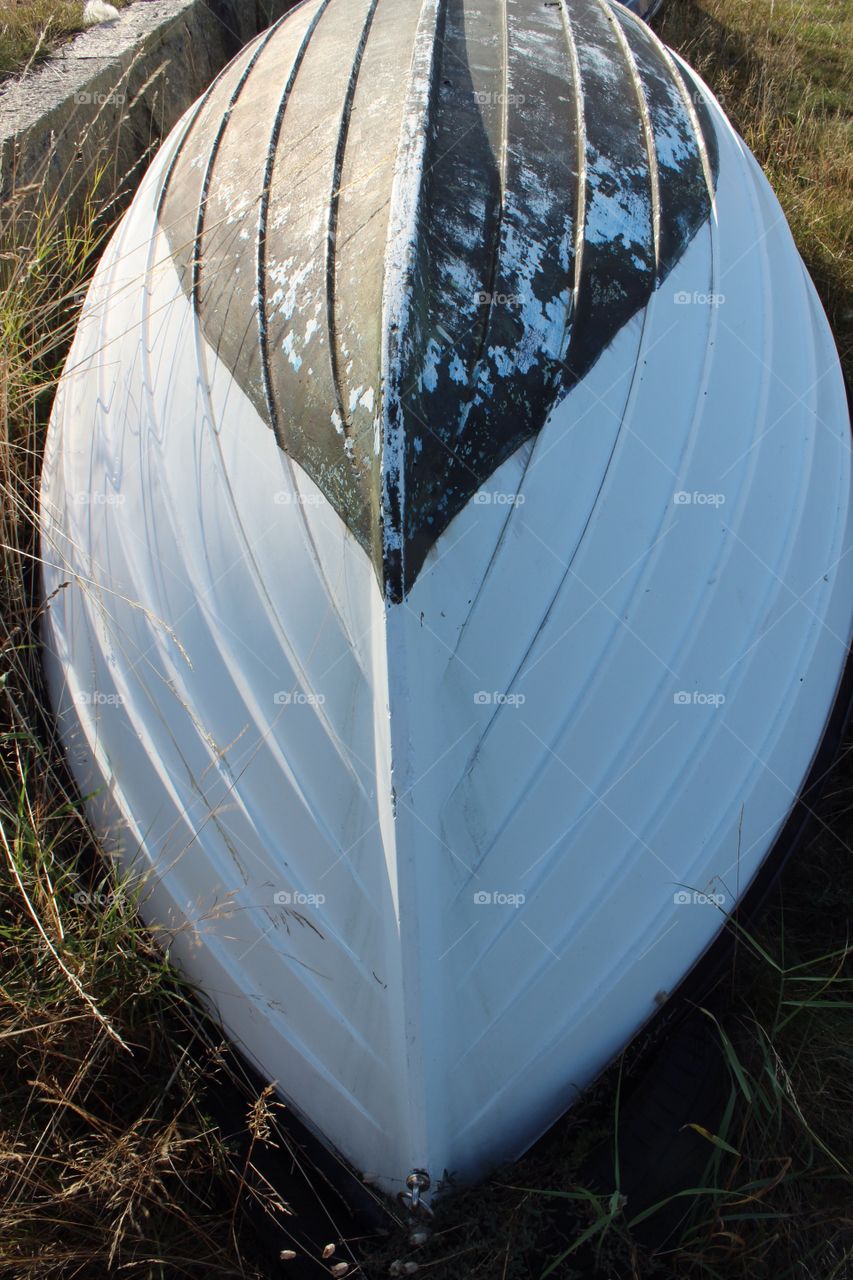 Wooden boat on the shore closeup