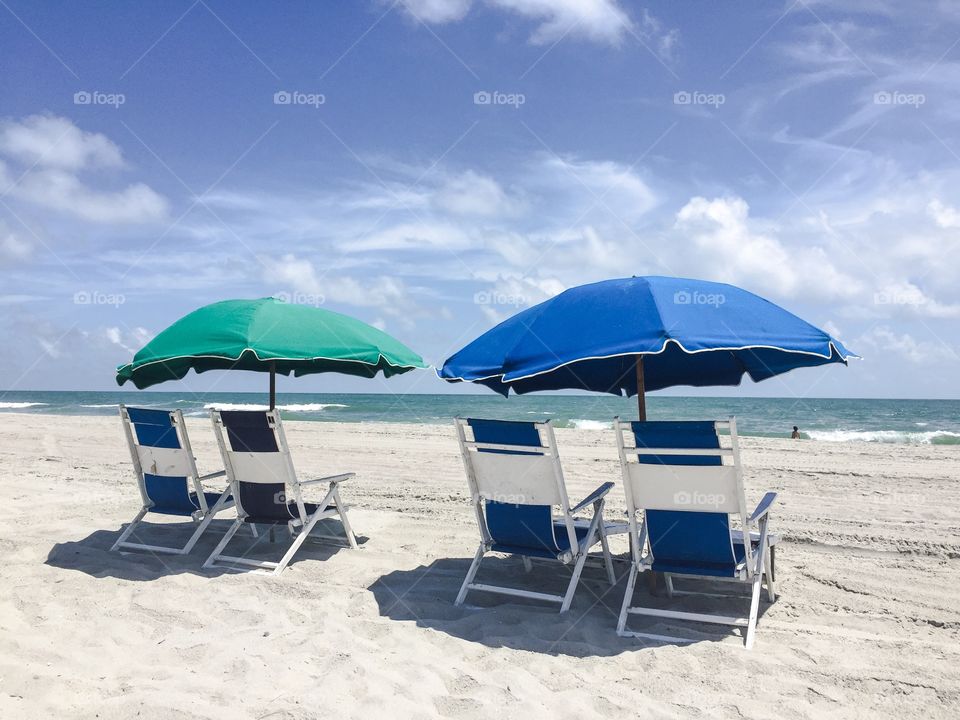 Beach chairs and umbrellas. 