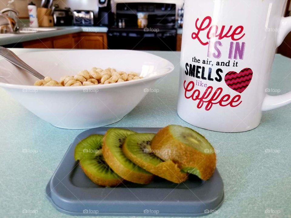 cheerios, coffee and kiwis for breakfast.