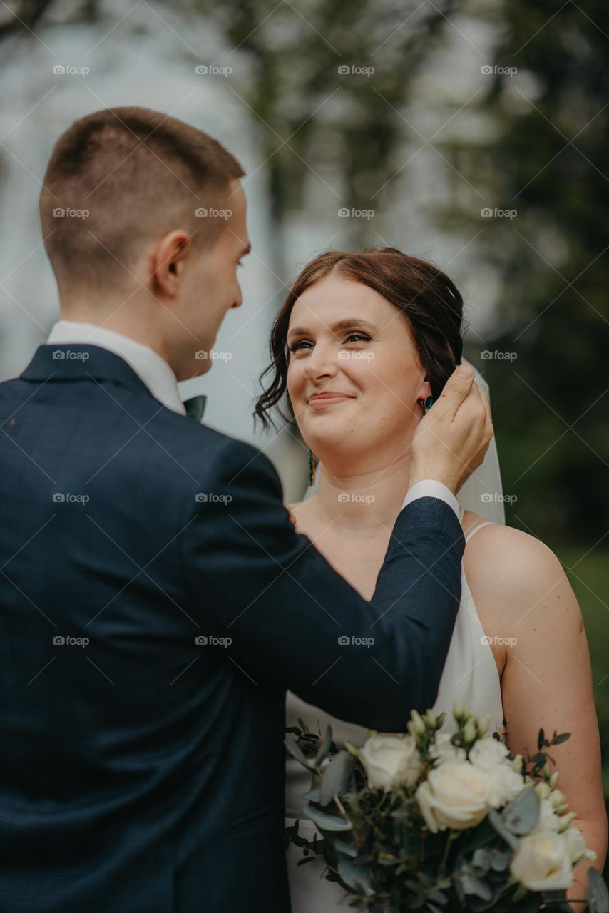 An emotional photo of two people during a wedding photo shoot