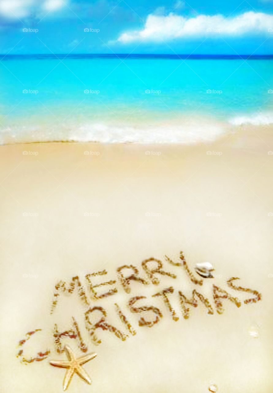 words written in sand on beach