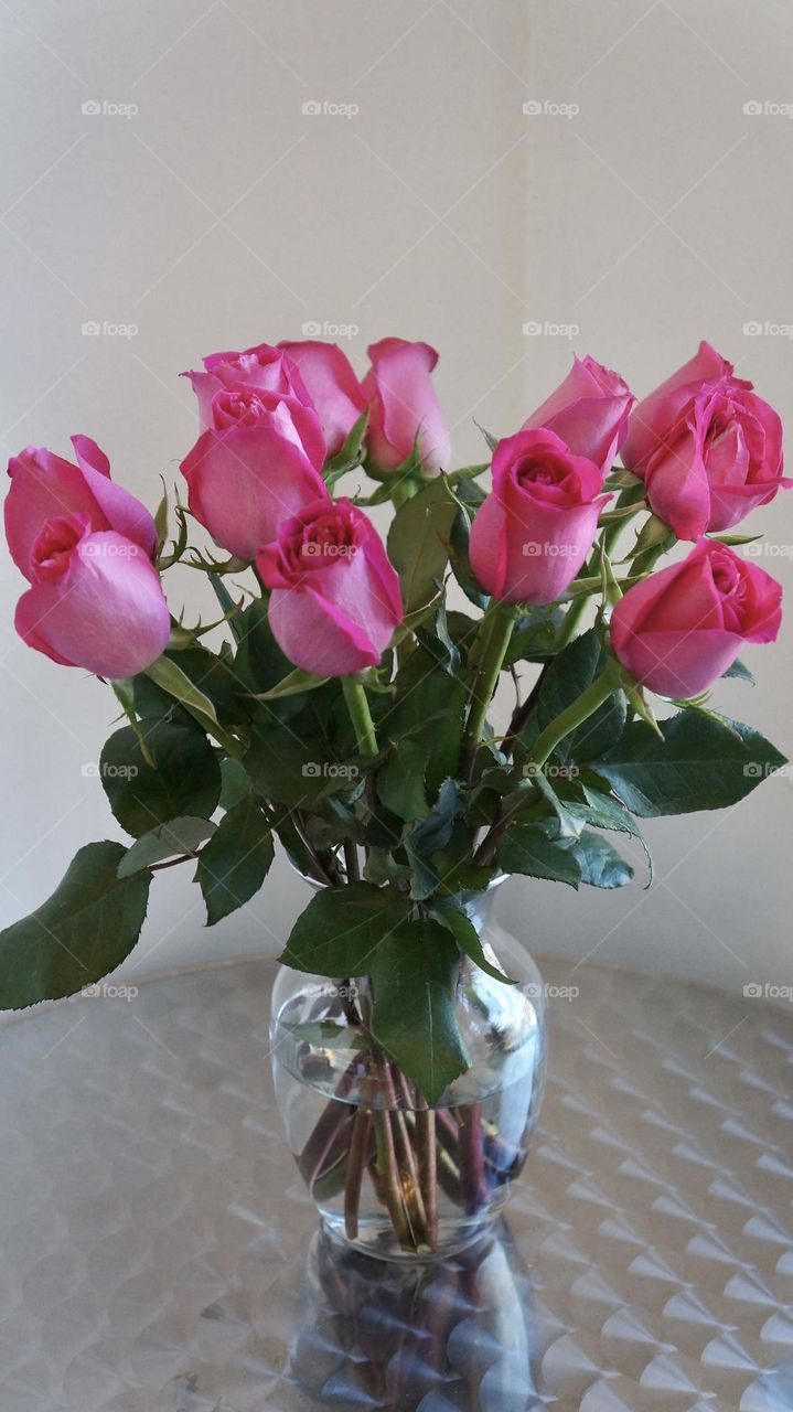 Pink roses in a vase , eye catching and beautiful. Pink roses represent femininity, refinement, sweetness, and elegance. 