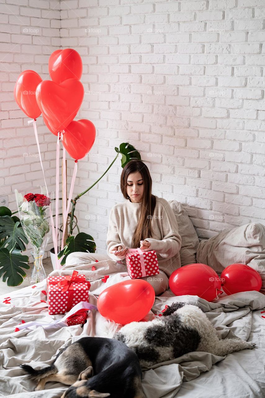 woman holding christmas gifts