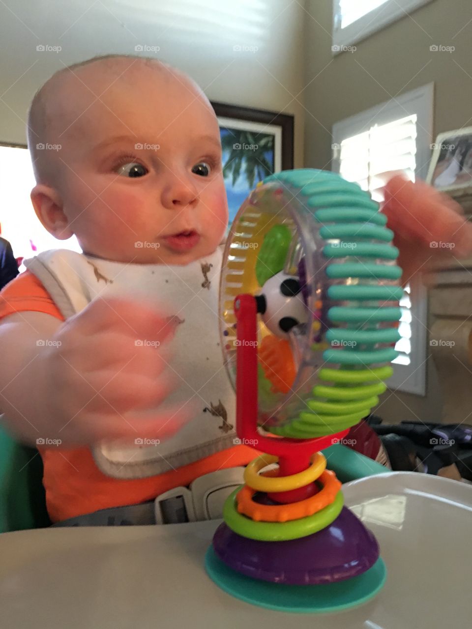 Surprise boy playing with toy