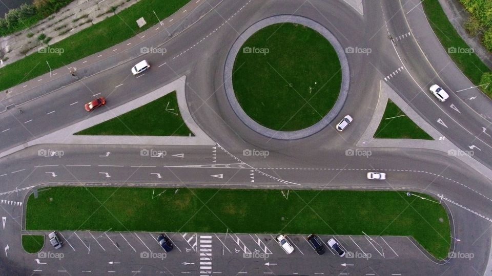Parking and round road with cars, view from above 