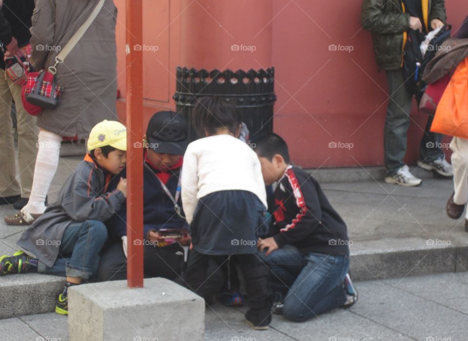 Japanese Kids Playing Outside  Kaminarimon, Asakusa, Tokyo, Japan.