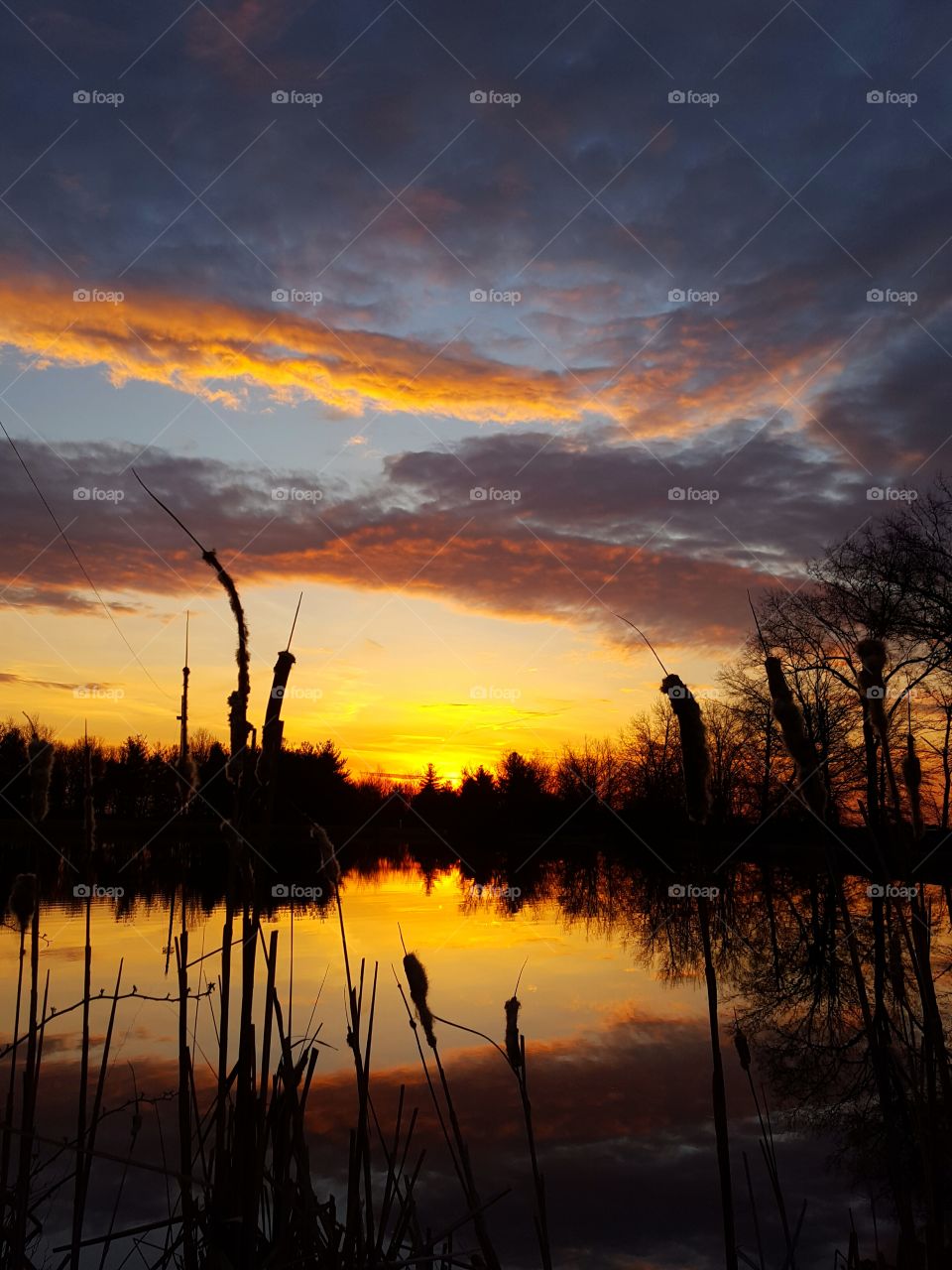 Dramatic clouds reflecting on lake