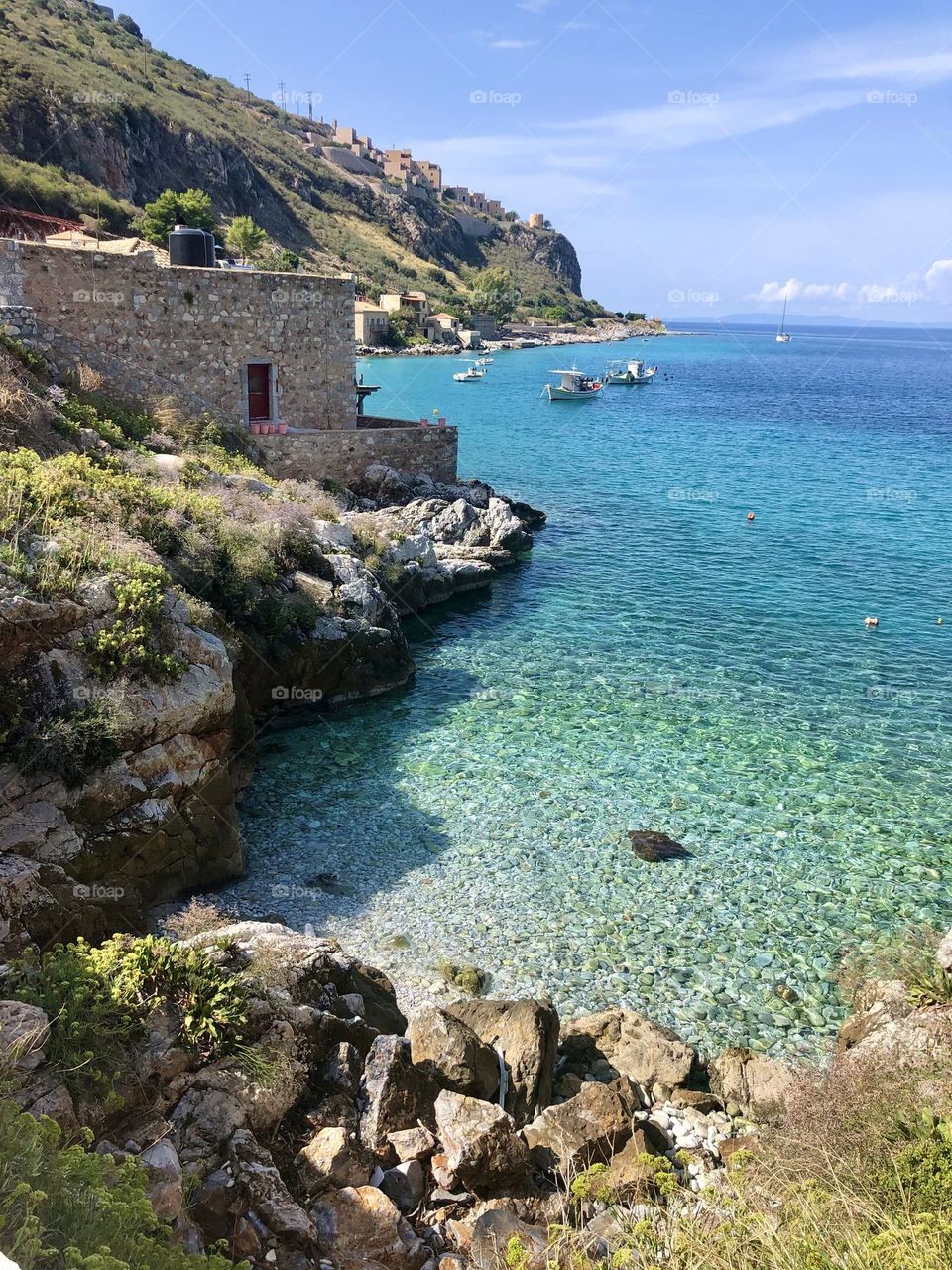 Enjoying the last days of summer with the crystal clear turquoise water in Limeni, Peloponnese, Greece