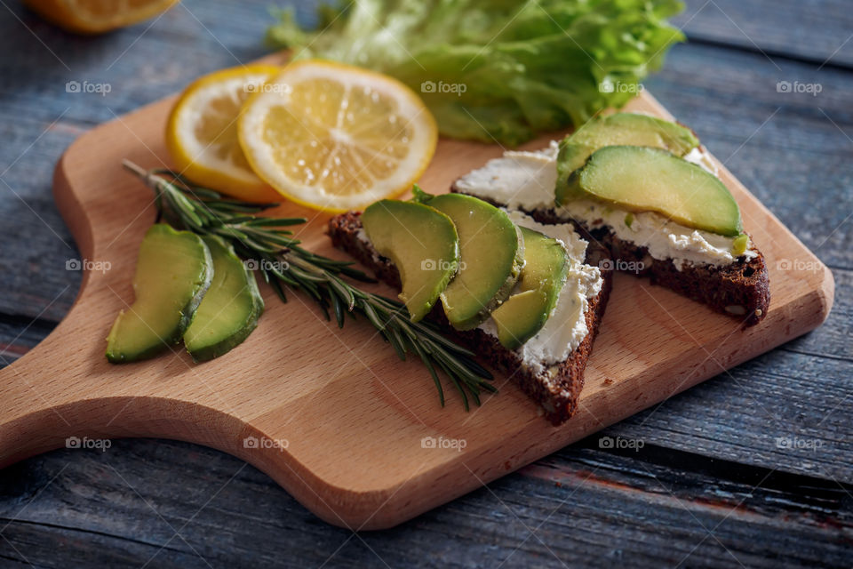 Dietary sandwiches with grain bread, cream cheese and avocado