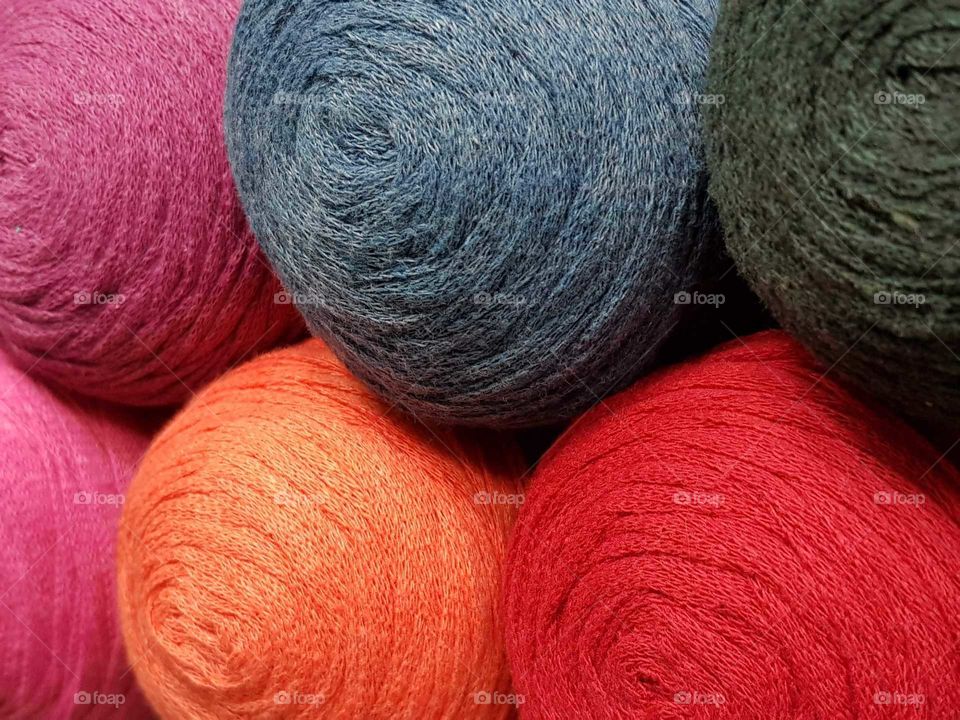 balls of multicolored wool . texture and background