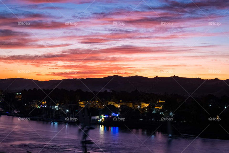 Sailing to see sunset over Nile river in Aswan , Egypt 