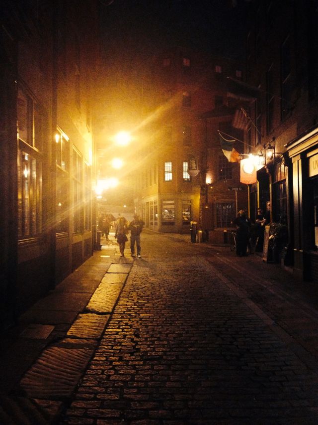 Cobblestone streets of Boston at night 

