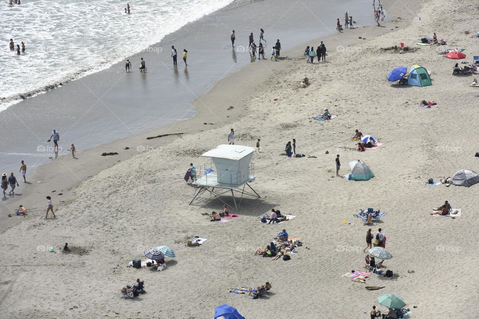 Beach goers soaking up the sun.