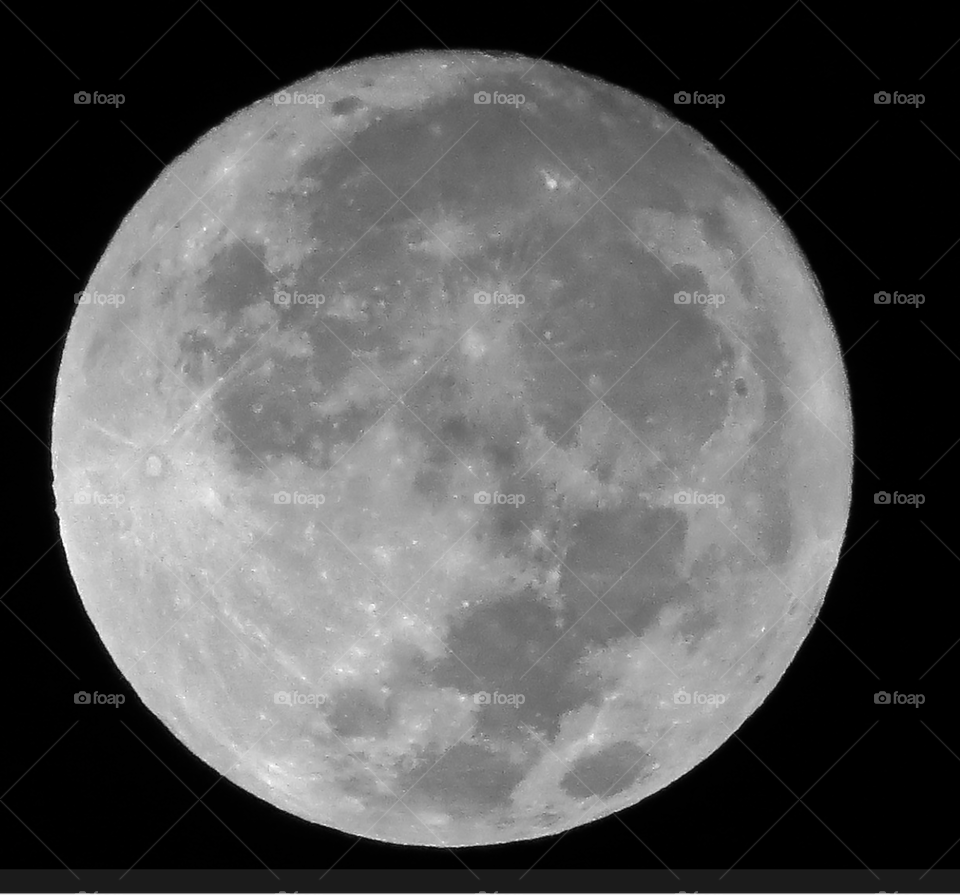 Black and white of an almost full moon
