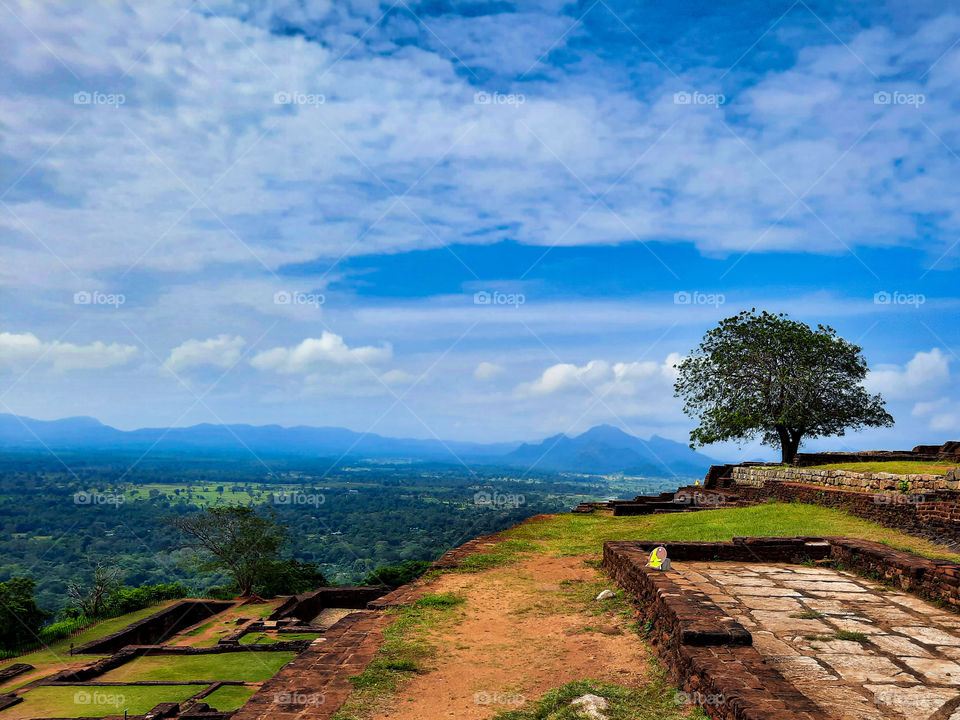 Magical view from the top of the roch fortress Sigiriya. This is a picturesque view of surrounding taken at the top of Sigiriya where the ruins of one of the royal palace remains. It is a complex city with one of best ancient urban planning.