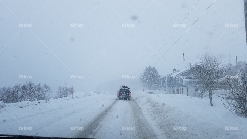 Driving in the snow blizzard