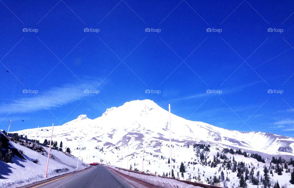 Scenic view of road leading toward mountain