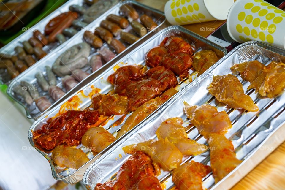 cooking the sausages and meat