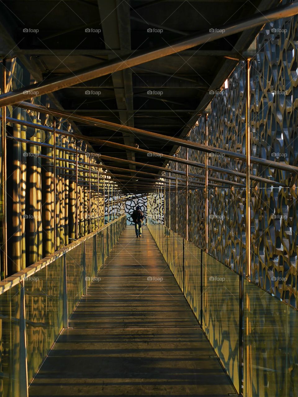 Distant view of people in metallic tunnel