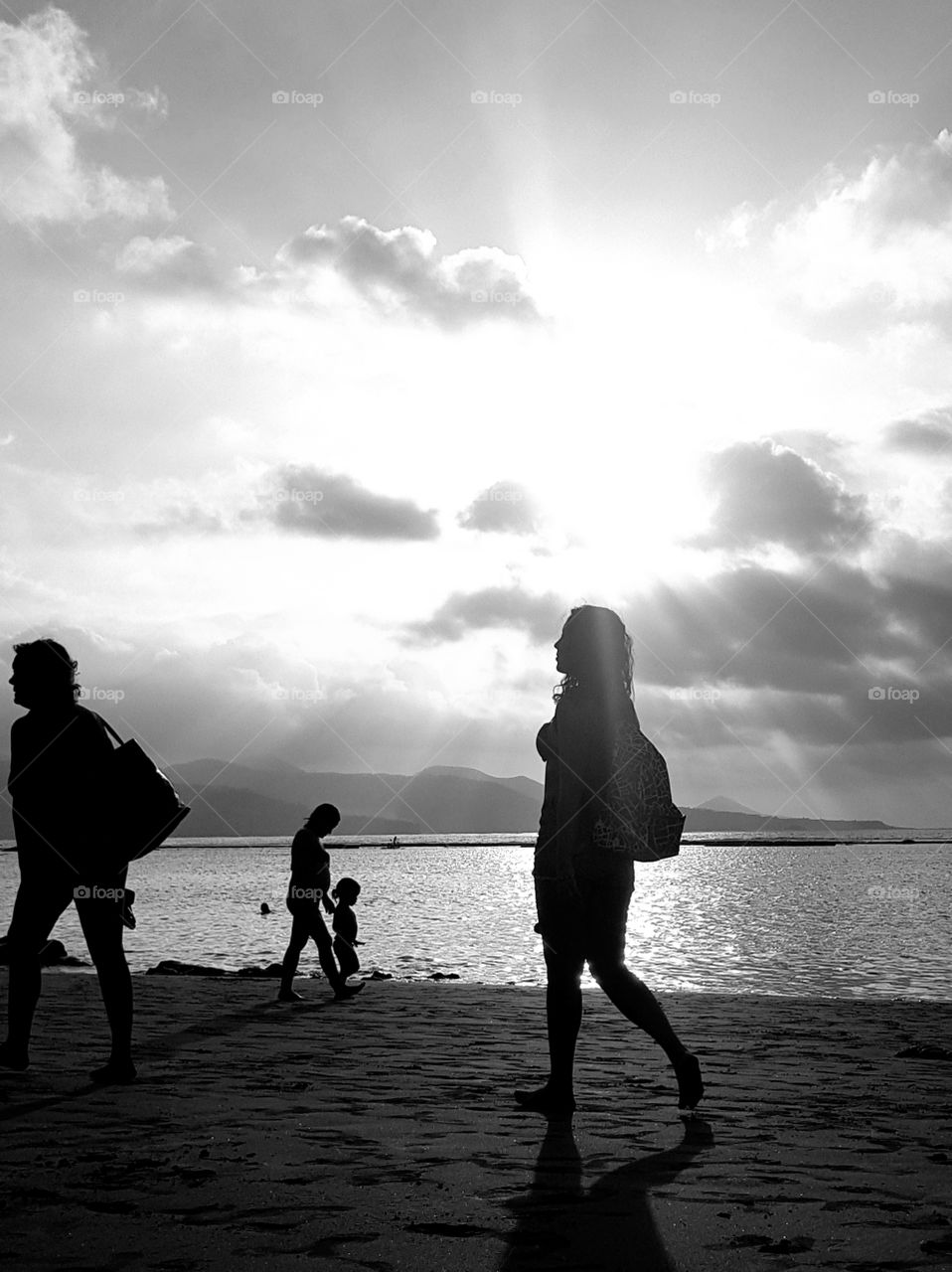 People walking by the seashore
